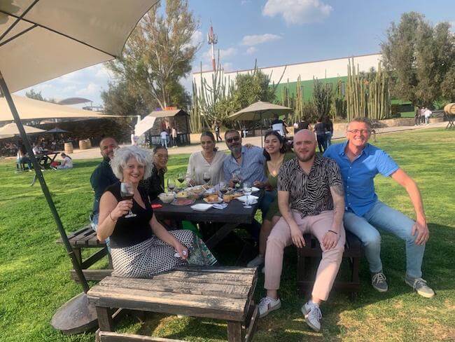 Letisha and I, with family and friends, drinking wine and eating cheese at a winery in Querétaro