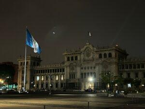 Main square of Guatemala City with the Guatemalan Flag at Night