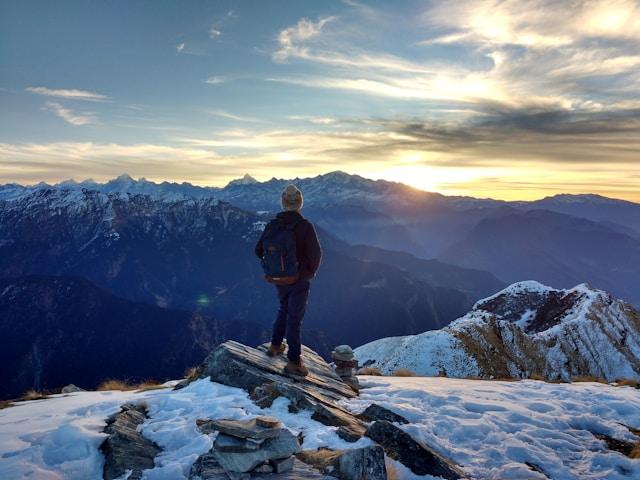 Solo traveler standing on a mountain