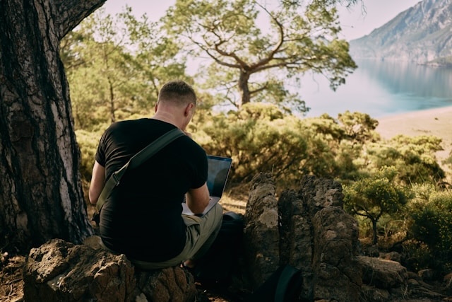 traveler using their laptop in remote location